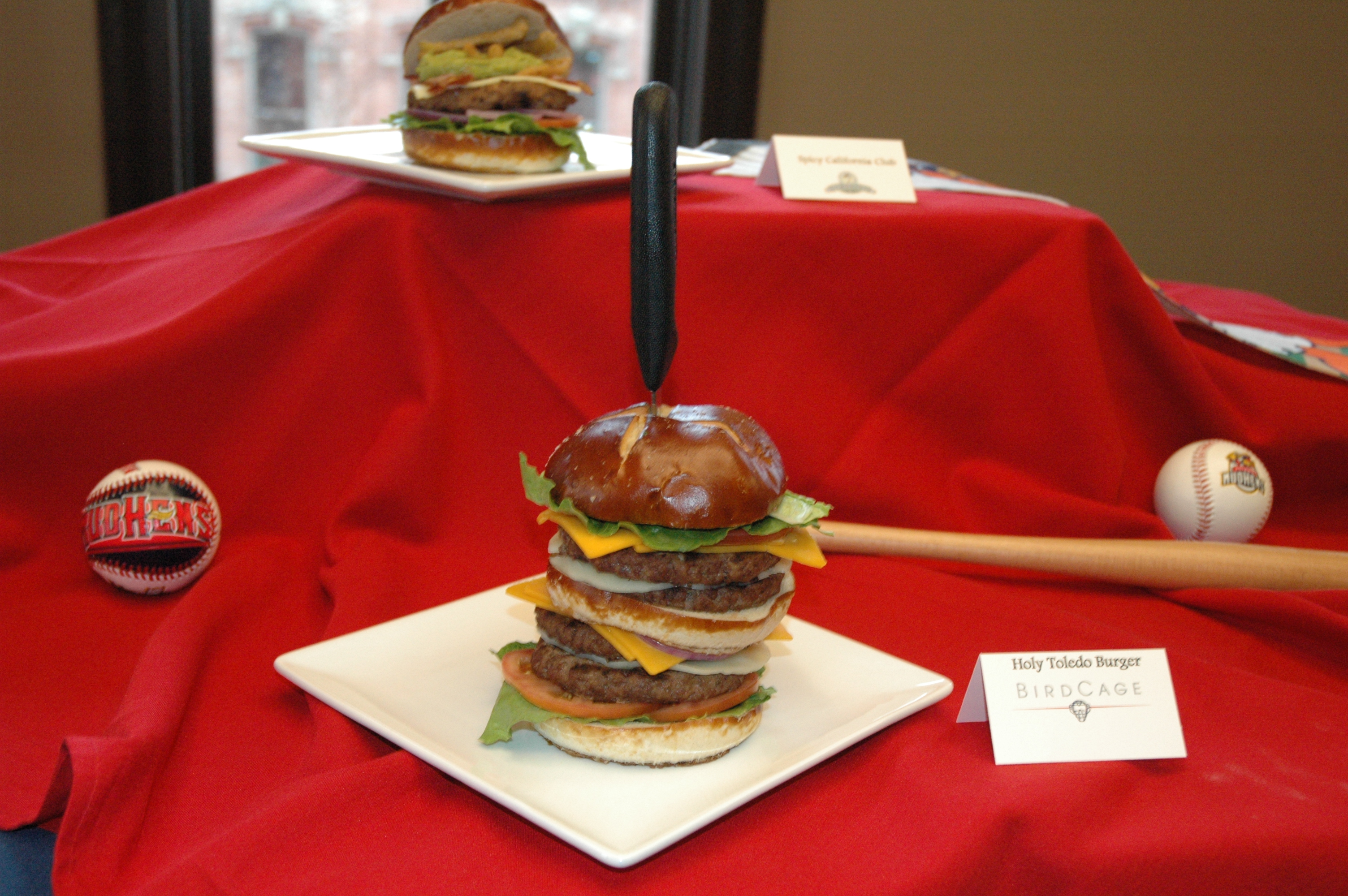 It could certainly be called the Holy “Tall-edo” Burger. Easily standing at 6+ inches tall, this culinary delight needs the support of a steak knife to remain upright.