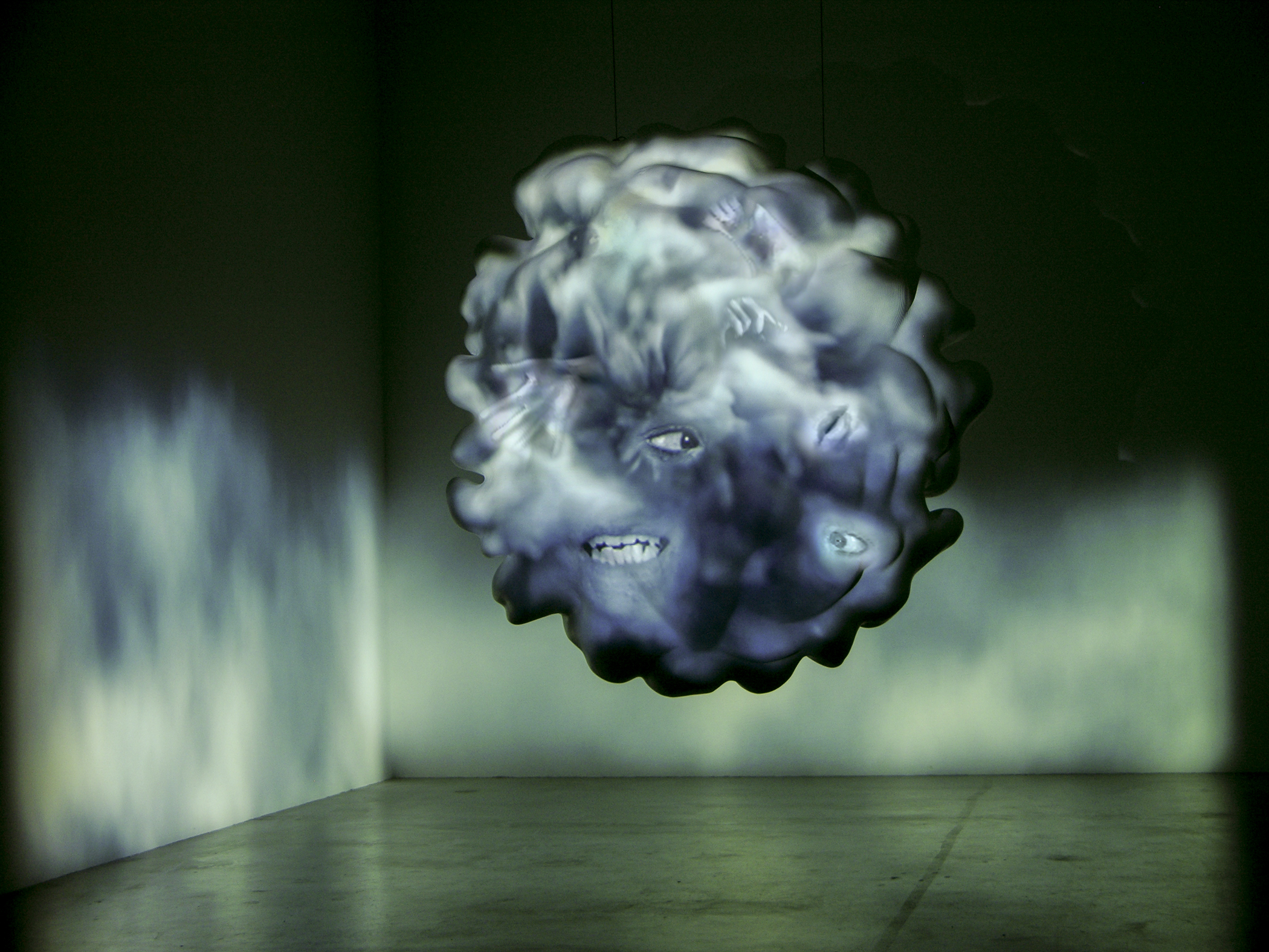 Tony Oursler (American, born 1957), Dust, from Thought Forms, 2006. Fiberglass sculpture, Hardon Kardon HS100 5.1 sound system, Sony XGA VPL-PXL-41 projector, 2 Sanyo PLC-XU48 projectors, 3 DVD players, 6 DVDs, and 3 master tapes. 72 × 72 × 72 in. The Broad Art Foundation, Los Angeles CA, F-Ours-1S06.05. Photo: Courtesy Tony Oursler. © Tony Oursler